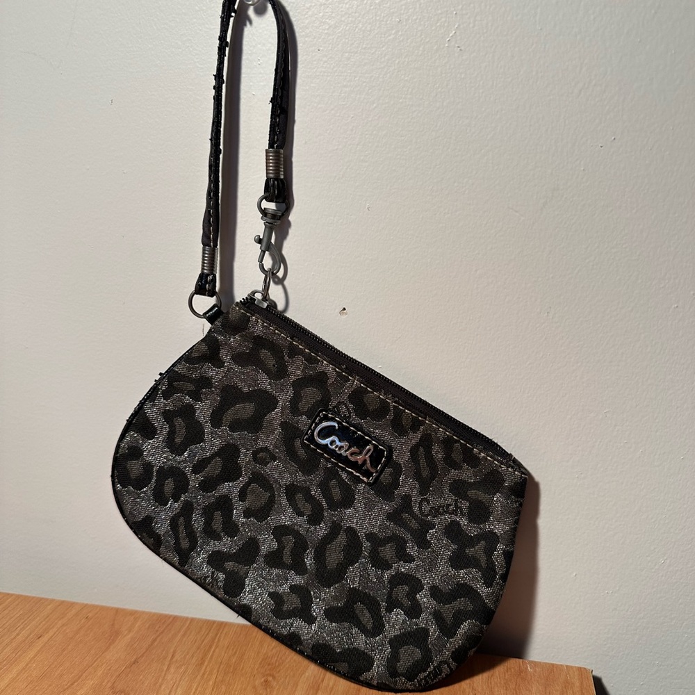 Coach Madison Ocelot Leopard Print wristlet in silver and black.